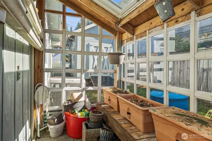 Garden shed/Greenhouse on the side of the home.