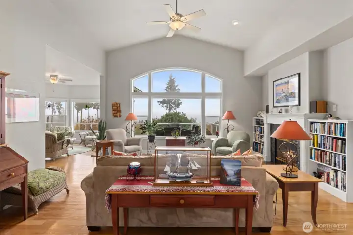 Formal living room with propane fireplace and views out to Mount Baker, Puget Sound, Utsalady Bay and the Cascades.