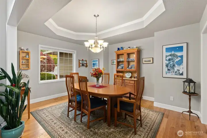 Formal dining room with gorgeous tray ceilings.