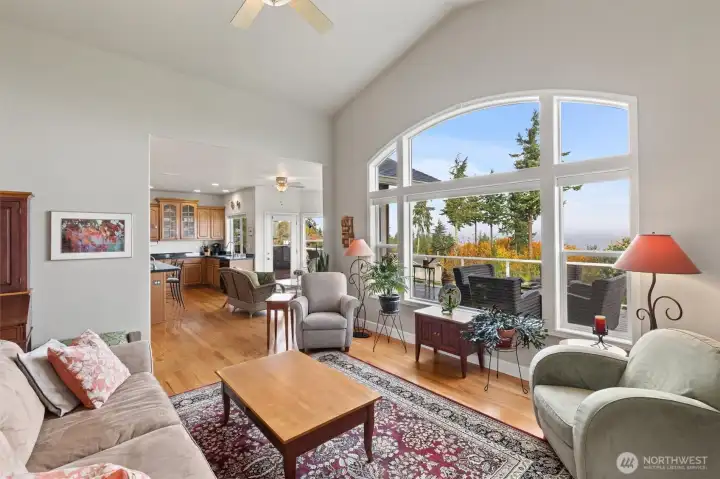 Formal living room opens to the breakfast area and kitchen.