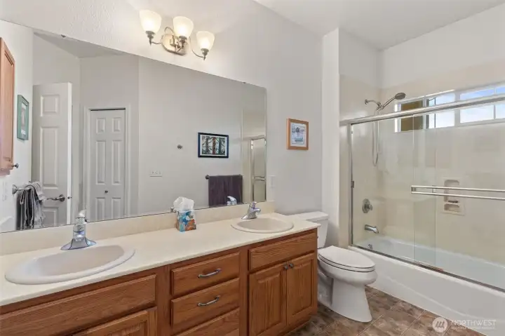 Guest bathroom on the main floor is incredibly spacious with dual sinks.
