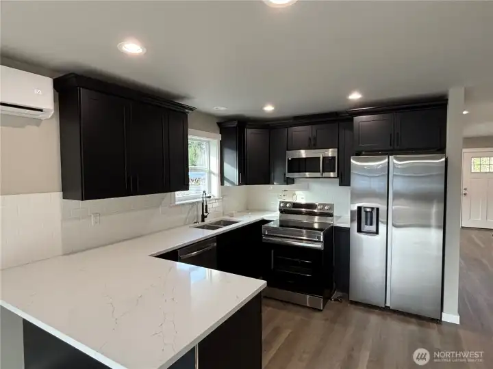 Kitchen with stunning black cabinets!