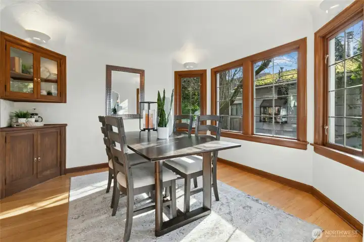 How will you use built-in cabinetry on each side of the dining room's entry to kitchen?