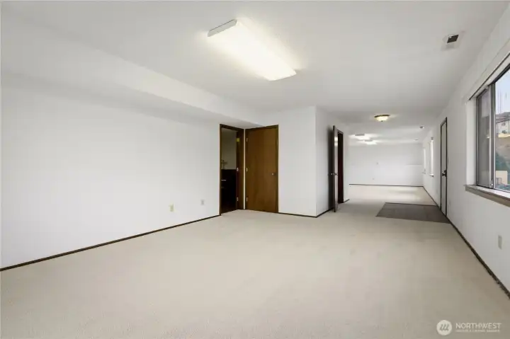 Lower Level Expansive Living Spaces - Large open space with excellent natural light - customize to suit your lifestyle needs.