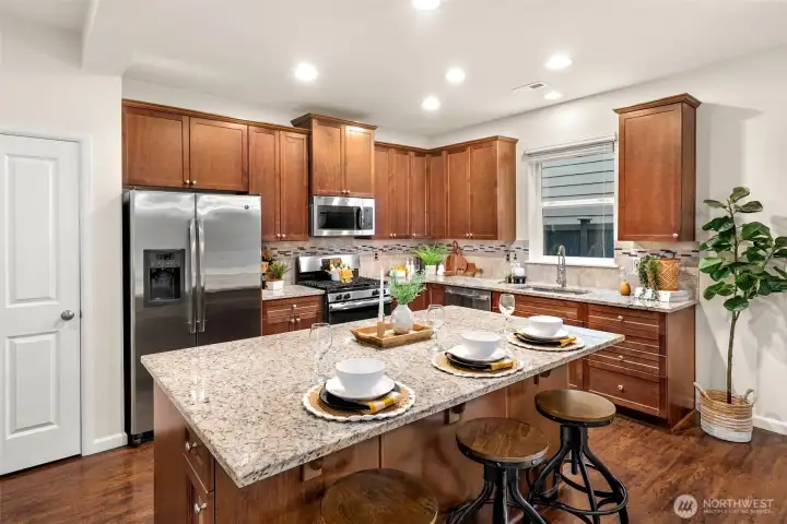 Spacious kitchen with island seating and gas cooktop