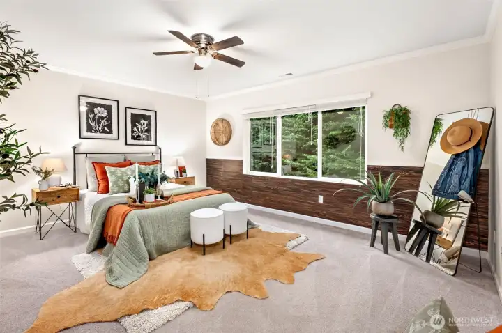 Relaxing primary bedroom with five-piece ensuite bath  and a large walk-in closet with custom built-in storage