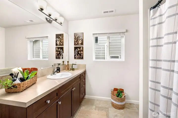 Spacious guest bathroom across the hall from guest bedrooms