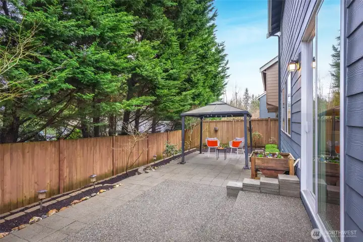 Easy to maintain backyard with gazebo that is fully fenced