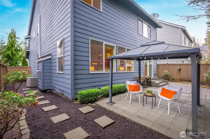 Easy to maintain backyard with gazebo that is fully fenced