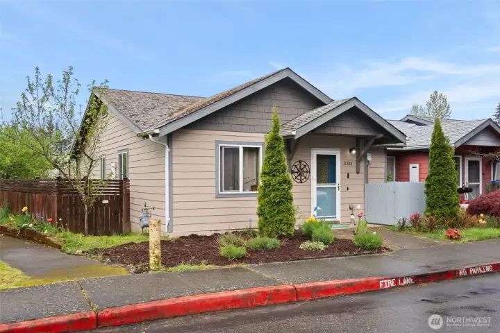 Beautifully maintained exterior and mature landscaping and corner presence.