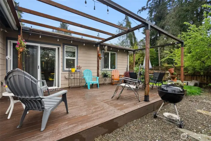 Summertime Ready! Your private retreat features a massive Trex deck, custom pergola, and plenty of space for outdoor dining.