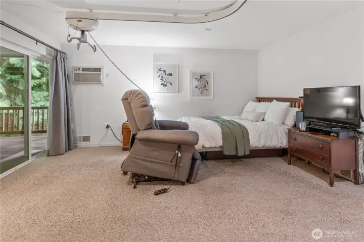 Large primary bedroom with access to primary bath and outside to wrap around deck.