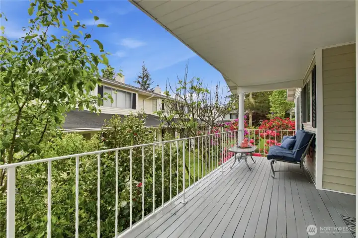 Covered, private front porch overlooking beautiful, lush gardens