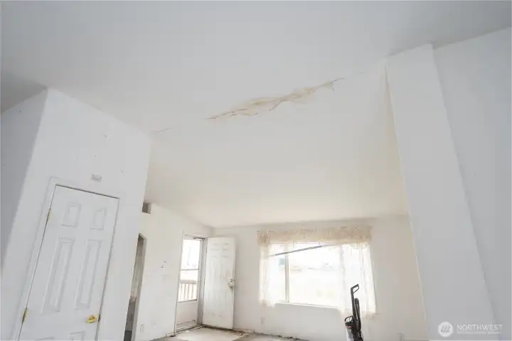 Notice the water damage on the ceiling - newer metal roof was installed after damage
