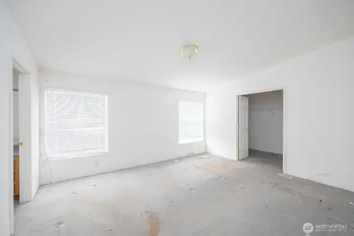 Primary Bedroom, with walk in closet on teh right, and bathroom on the left.
