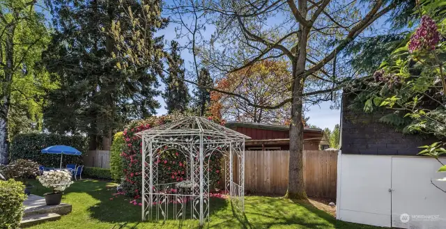 The gazebo and playhouse/potting shed lends charm to the private backyard.