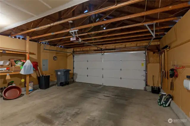 two car garage with storage areas