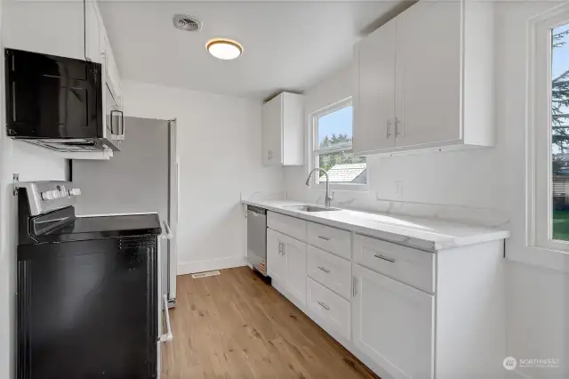 New soft-close cabinets and quartz countertops.