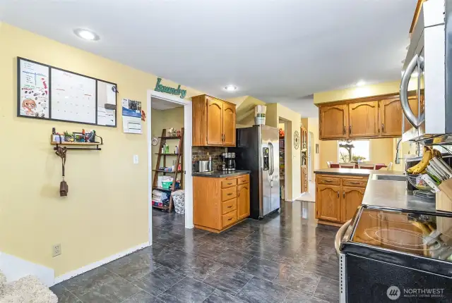 Looking from the Second Staircase of the Home to the Kitchen~Two Staircases Serve the Upper Level~One @ Each end of the Home~