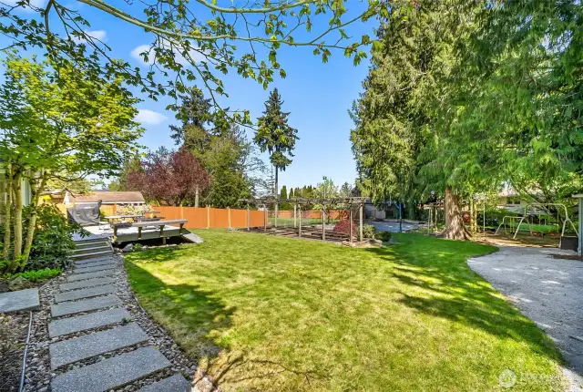 Pathway from RV Parking to the Patio~Trek Decking with Built in Seating~Turn up the Traeger~Playground for the Kiddo's~Sport Court~Raised Bed Gardening~Let's stay Home~