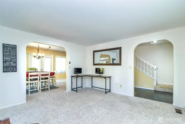 Opposite View of the Formal Living area Opens to both Dining & Front Door Entry~One of Two Staircases Leading to the Second Story~