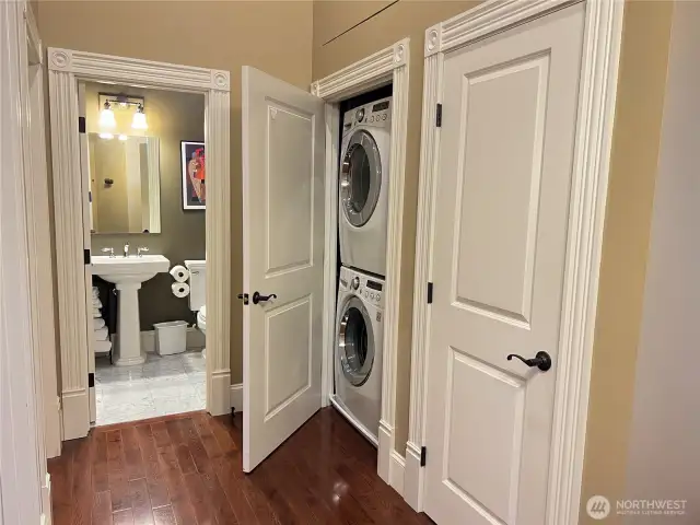 Utility closet in hallway conveniently located across from bedrooms.