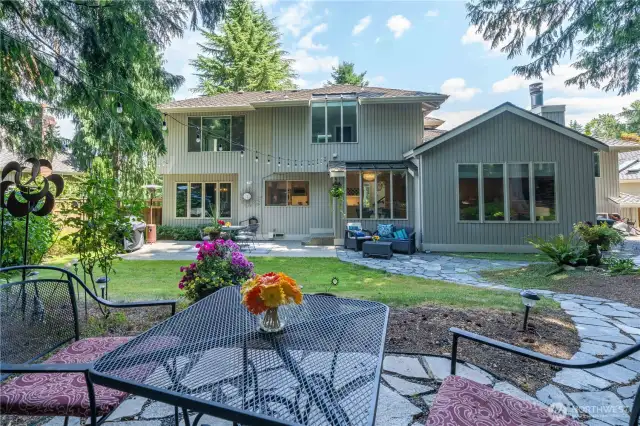 Tranquil back yard with room to play, entertain, or just relax.