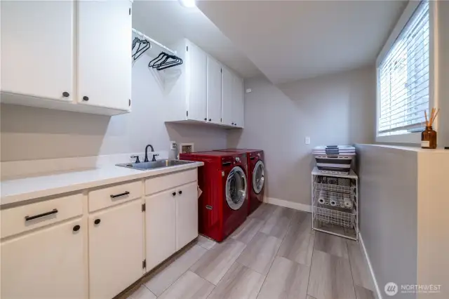 Updated main floor utility room off of the garage.  Washer and Dryer are included.