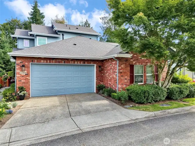Beautiful brick accents, landscaping for maximum privacy and plenty of room for two cars in the driveway