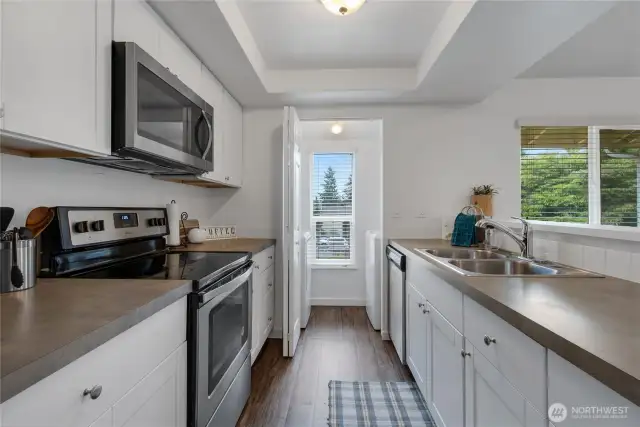 The kitchen offers newer cabinets and plenty of counter space.
