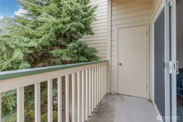 One side of the balcony w/ additional storage unit.