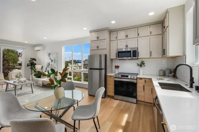 An open-concept layout lets the kitchen, dining, and living areas flow together effortlessly, creating a bright and connected space for cooking, dining, and relaxing