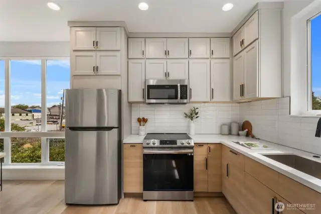 Matching Frigidaire stainless steel appliances bring a polished, modern look to the kitchen while offering dependable performance, complemented by abundant cabinet space for all your storage needs.