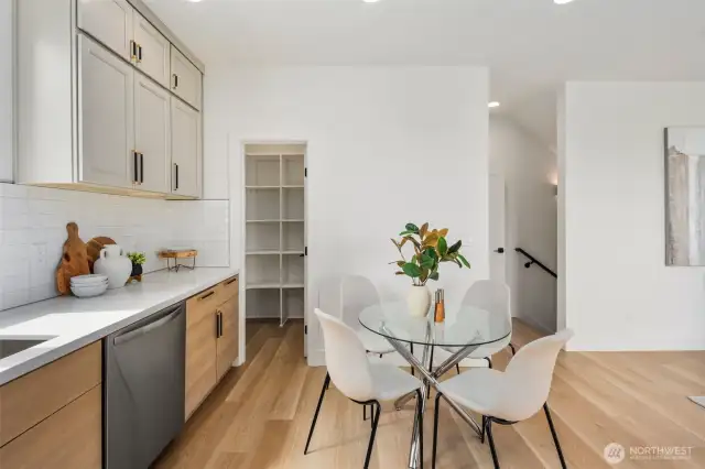 A spacious walk-in pantry sits just off the kitchen, offering abundant storage and easy access to all your essentials.