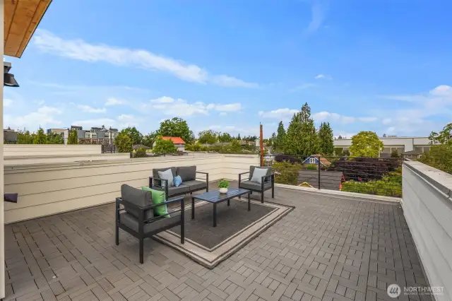 Take in sweeping neighborhood views from this spacious rooftop deck, perfect for morning coffee or evening gatherings.