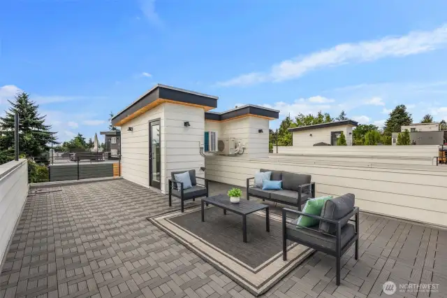 The generous layout offers room for both seating and dining areas, making it ideal for entertaining under the sky.
