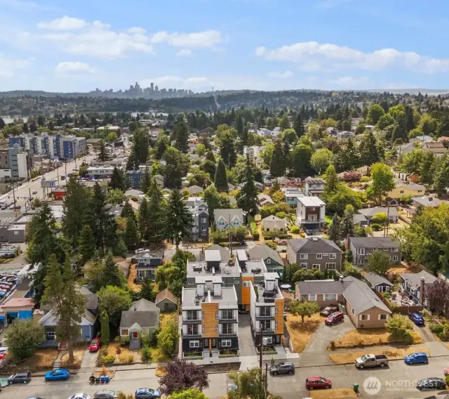 From this elevated perspective, you can see the home’s prime location—nestled in a charming neighborhood with the Seattle skyline rising in the distance. It’s the perfect balance of peaceful community living and easy access to the vibrant heart of the city.