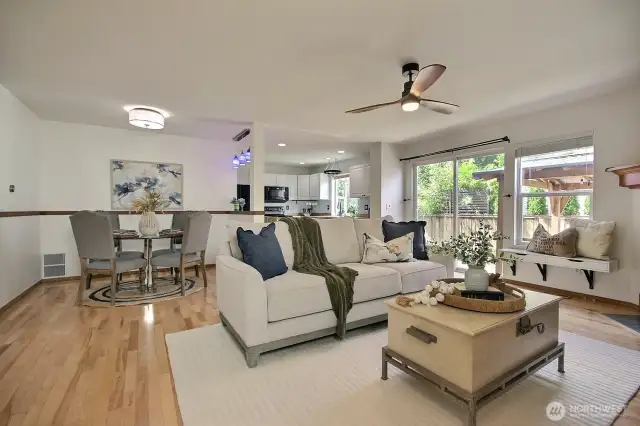 Dining area flows seamlessly into the kitchen and features a breakfast bar.