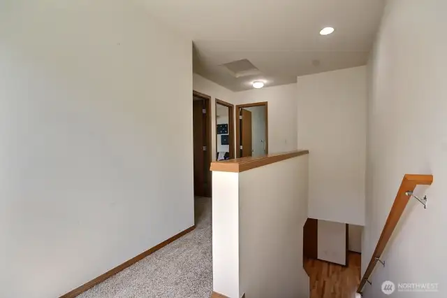 Light filled landing. The 2 additional bedroom can be seen on the left.