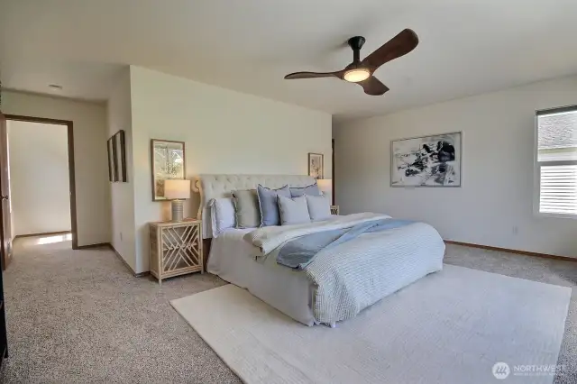 Huge Primary Suite with ceiling fan.