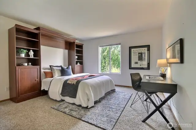 One of the 2 additional bedrooms features a Murphy bed system that stays!