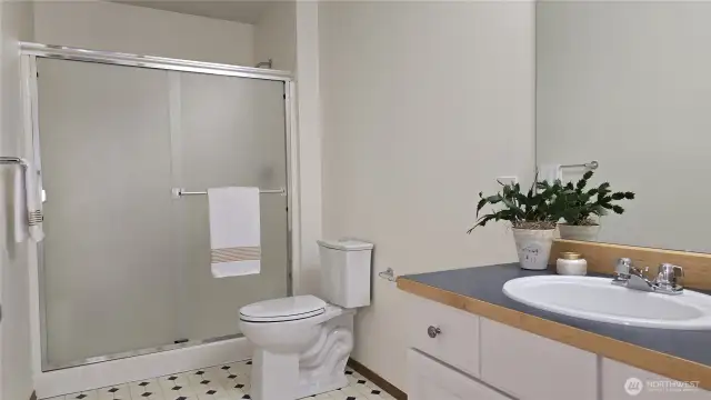 Upper level guest bathroom with walk-in shower.