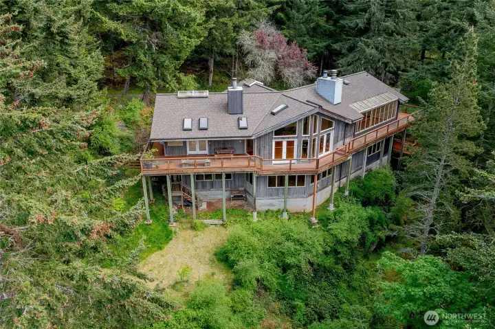 The home offers privacy from neighbors, situated amongst beautiful forest trees. Low maintenance grounds
