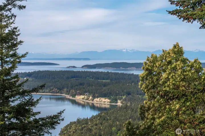 Marine views of Orcas Island in the foreground, the Sucia group and the Canadian Cascades in the distance