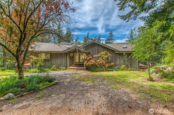 The home has a convenient circle drive and few stairs to the main level