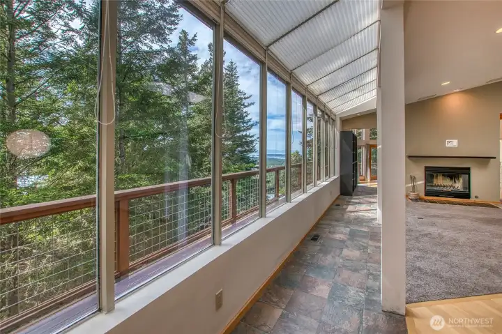 The window wall goes the distance on the west wall on the main floor offering bright, natural light and calmness