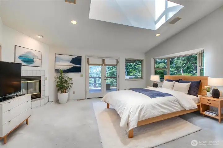 The primary bedroom has double doors to the west facing deck plus a fireplace for cool evenings