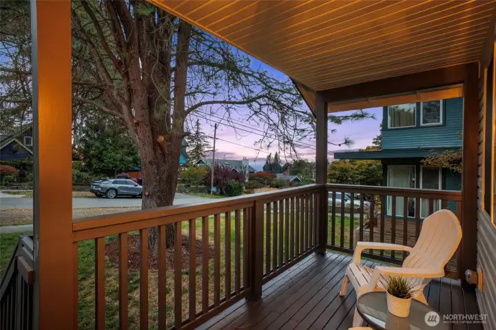 Enjoy summer breezes, stunning sunsets, and partial Sound, mountain & Port views from the covered front porch and living room.