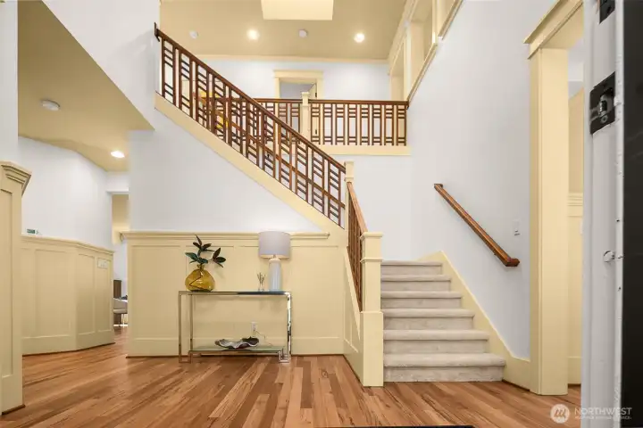 A grand entrance: vaulted ceilings, skylights, trims, hardwood floors