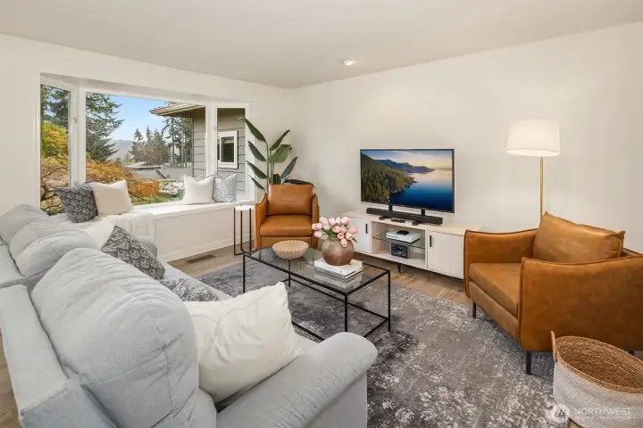 Living Room with a cute bump out garden window.